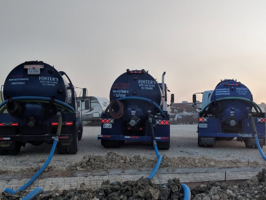 Foster&rsquo;s trucks on a big job at sunrise